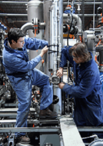 Two men performing maintenance on a system