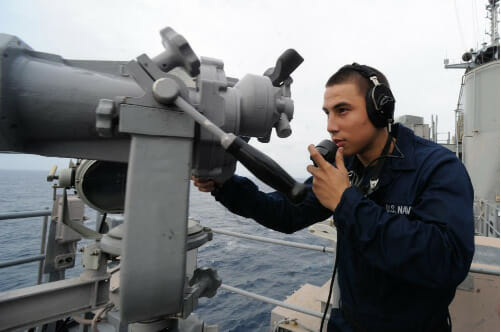 Navy personnel performing duty on a battleship